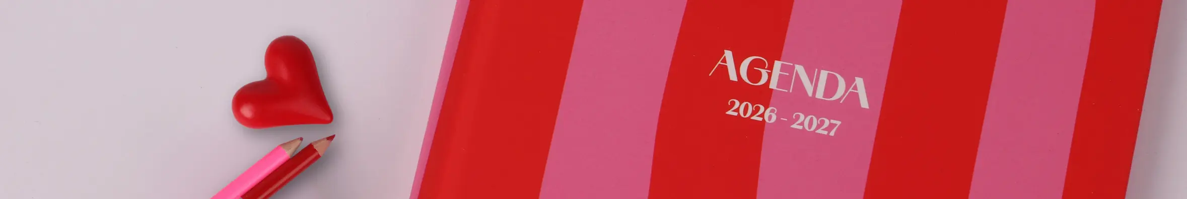 schoolagenda 2026 met roze strepen en een rood lint
